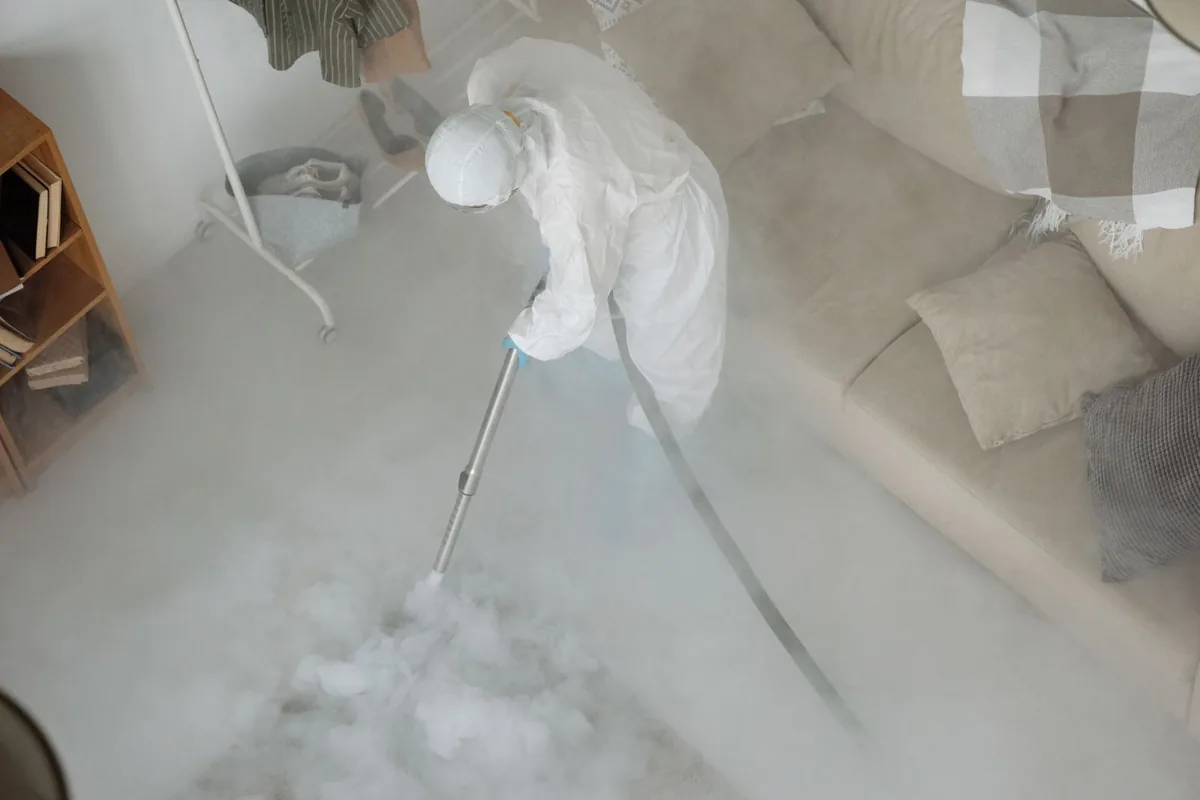 Biohazard cleanup technician in protective equipment, Mahopac, NY